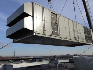 HVAC Equipment Being Lifted onto Building Roof